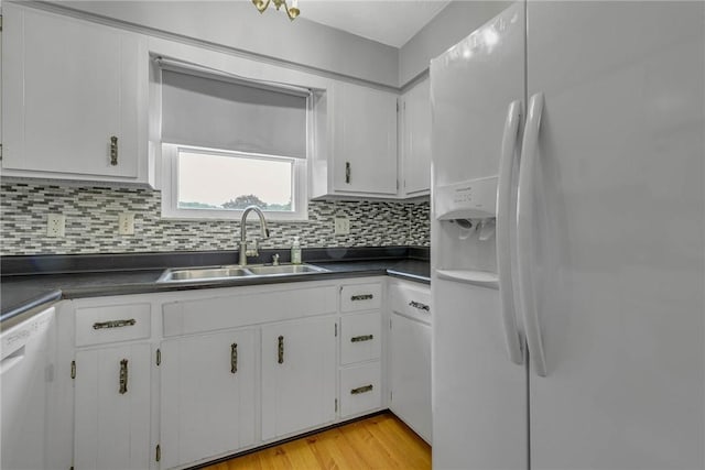 907 3rd St, Baden, PA 15005 - kitchen featuring white refrigerator with ice dispenser, a sink, dishwasher, dark countertops, and tasteful backsplash