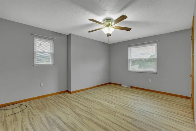 907 3rd St, Baden, PA 15005 - unfurnished room featuring ceiling fan, baseboards, light wood-type flooring, and a textured ceiling