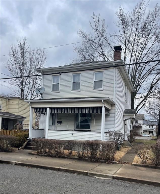 1213 Virginia Ave, Monaca, PA 15061 - view of front of home with covered porch and a chimney