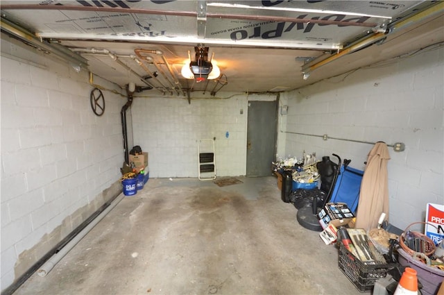 43 Bellevue Ave, West View, PA 15229 - garage with a garage door opener, heating unit, and concrete block wall