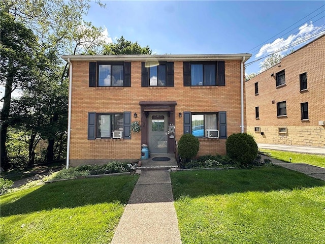 43 Bellevue Ave, West View, PA 15229 - view of front facade with brick siding, a front lawn, and cooling unit