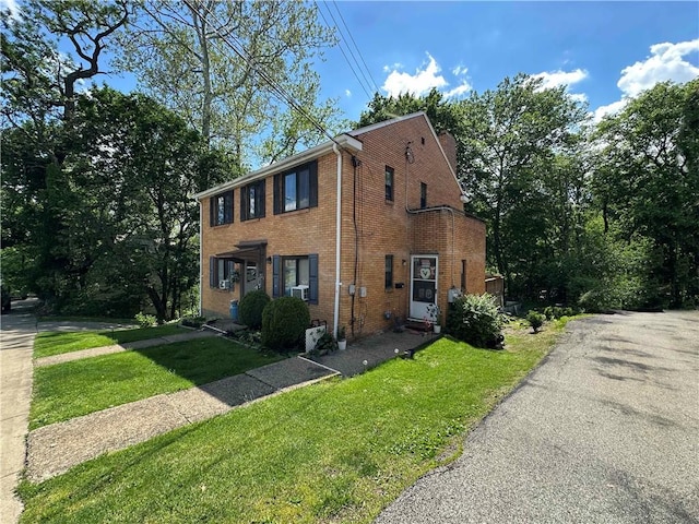 43 Bellevue Ave, West View, PA 15229 - view of front of home with brick siding and a front yard