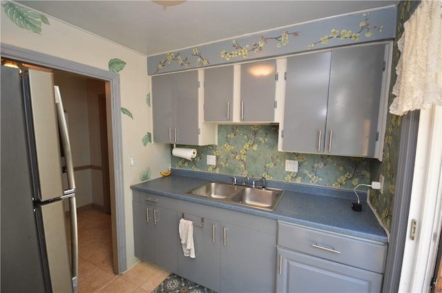 43 Bellevue Ave, West View, PA 15229 - kitchen with freestanding refrigerator, a sink, gray cabinetry, dark countertops, and light tile patterned flooring