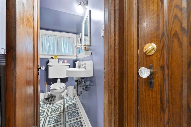 218 Barth Ave, Mt Lebanon, PA 15228 - half bath featuring toilet, baseboards, tile patterned floors, and a sink