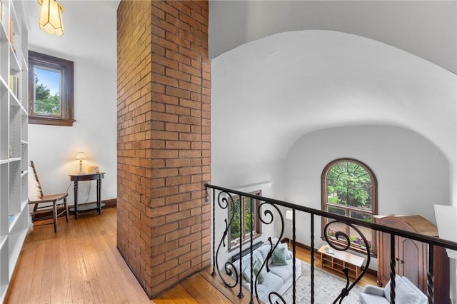 218 Barth Ave, Mt Lebanon, PA 15228 - corridor with light wood-style flooring, arched walkways, and an upstairs landing