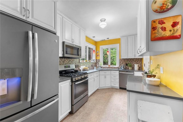 218 Barth Ave, Mt Lebanon, PA 15228 - kitchen featuring stainless steel appliances, dark countertops, and white cabinets