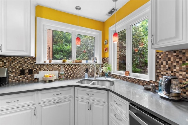 218 Barth Ave, Mt Lebanon, PA 15228 - kitchen with a sink, stainless steel dishwasher, white cabinetry, and tasteful backsplash