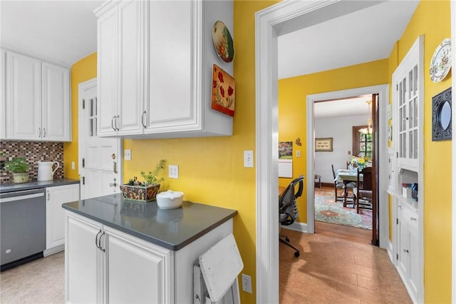 218 Barth Ave, Mt Lebanon, PA 15228 - kitchen with stainless steel dishwasher, dark countertops, white cabinetry, and decorative backsplash
