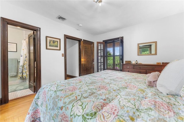 218 Barth Ave, Mt Lebanon, PA 15228 - bedroom featuring wood finished floors, connected bathroom, and french doors