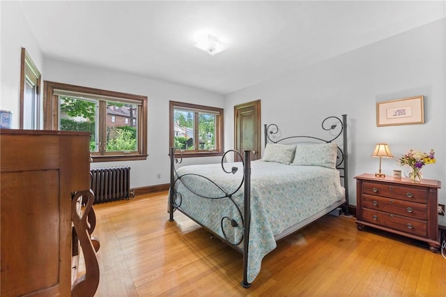 218 Barth Ave, Mt Lebanon, PA 15228 - bedroom featuring radiator heating unit, light wood finished floors, and baseboards