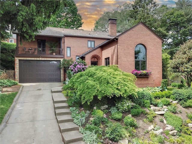 218 Barth Ave, Mt Lebanon, PA 15228 - view of front of home featuring brick siding, a chimney, driveway, and a balcony