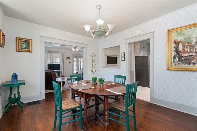 800 4th St, Beaver, PA 15009 - dining room featuring a chandelier, wood-type flooring, wallpapered walls, and baseboards