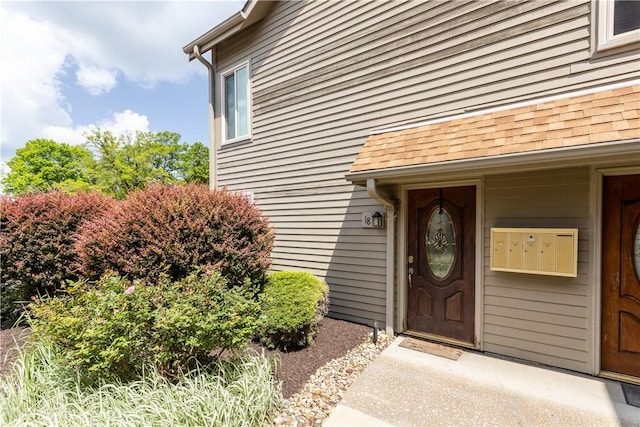 1265 Norberry Ct Unit 18, Cranberry Twp, PA 16066 - view of exterior entry featuring roof with shingles