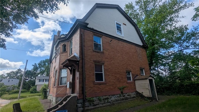 315 Lowell St, East Liberty, PA 15206 - rear view of property with brick siding and a chimney