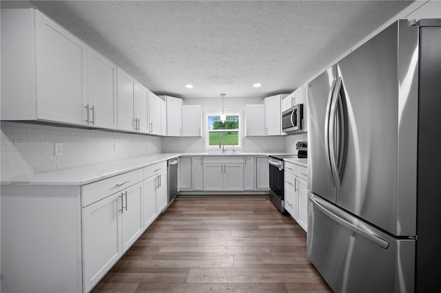 44 Heritage Hills Rd, South Union Twp, PA 15401 - kitchen with stainless steel appliances, a textured ceiling, a sink, recessed lighting, and dark wood-style flooring