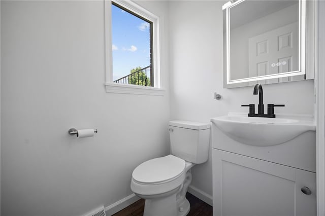 44 Heritage Hills Rd, South Union Twp, PA 15401 - half bath featuring baseboards, wood finished floors, toilet, and vanity
