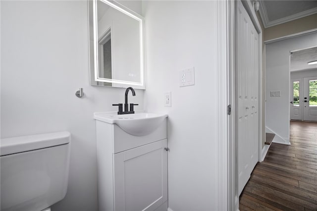 44 Heritage Hills Rd, South Union Twp, PA 15401 - half bath with wood finished floors, vanity, toilet, ornamental molding, and baseboards