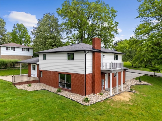 44 Heritage Hills Rd, South Union Twp, PA 15401 - back of property with a chimney, a yard, brick siding, and a wooden deck