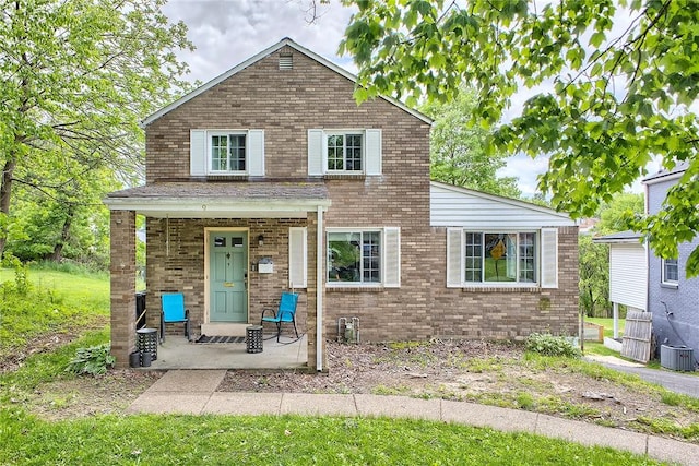 9 Forest Ave, City Of Greensburg, PA 15601 - view of front of home with brick siding, covered porch, and central air condition unit