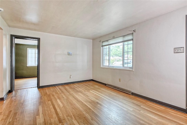 9 Forest Ave, City Of Greensburg, PA 15601 - spare room with light wood finished floors, baseboards, and a baseboard radiator