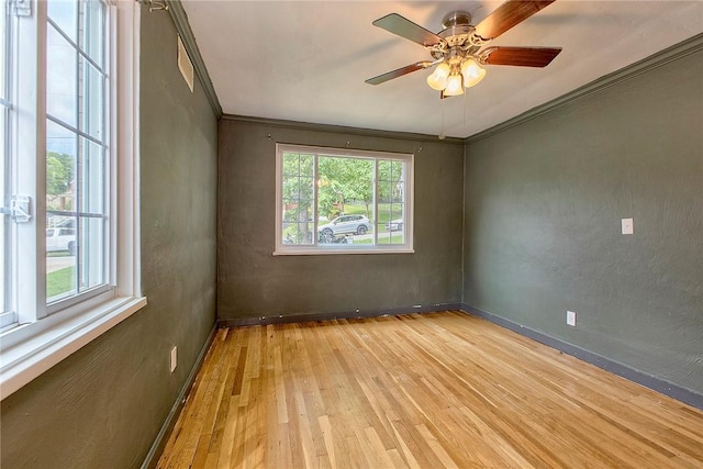 9 Forest Ave, City Of Greensburg, PA 15601 - unfurnished room with light wood-style floors, healthy amount of natural light, ceiling fan, and crown molding