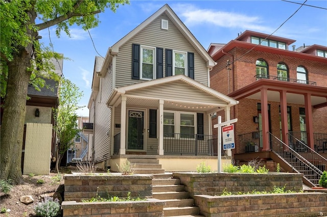 715 Filbert St, Shadyside, PA 15232 - view of front facade with covered porch, stairway, and brick siding
