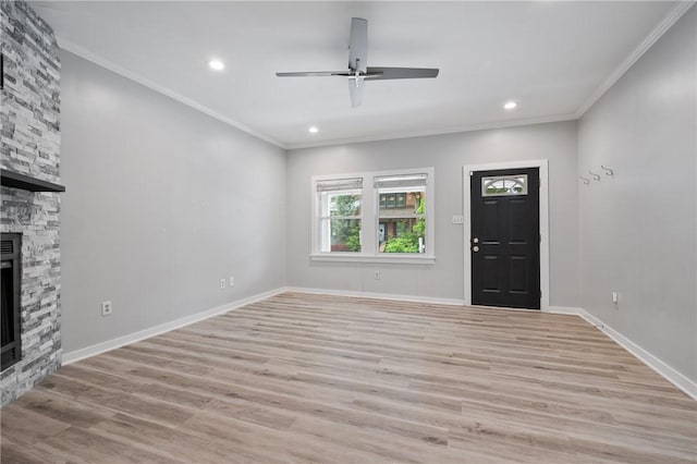 715 Filbert St, Shadyside, PA 15232 - unfurnished living room with a stone fireplace, a ceiling fan, light wood finished floors, ornamental molding, and recessed lighting