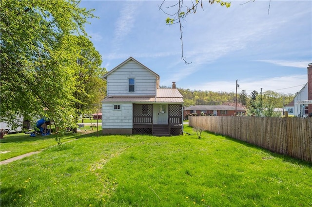 106 Level St, Bentleyville, PA 15314 - back of house with metal roof and a chimney