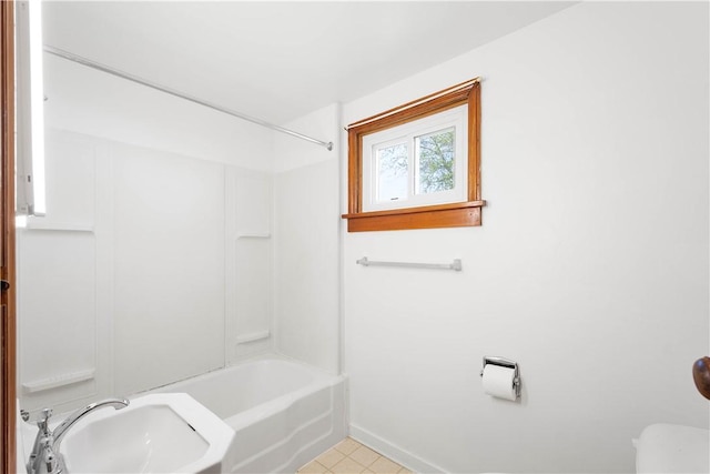 106 Level St, Bentleyville, PA 15314 - bathroom featuring toilet, baseboards, and bathing tub / shower combination