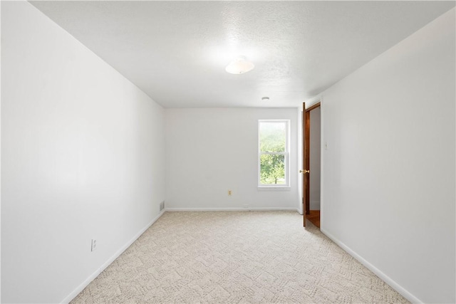 106 Level St, Bentleyville, PA 15314 - unfurnished room with light colored carpet, baseboards, and a textured ceiling