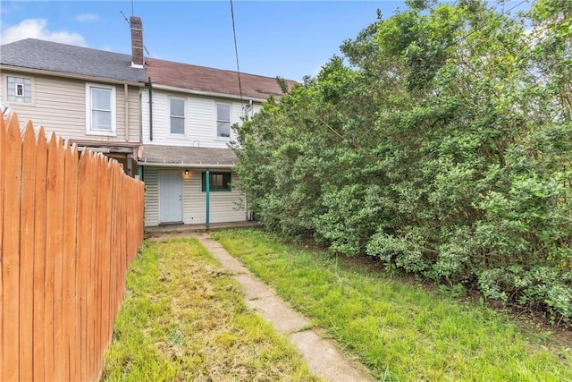 1630 Poplar Way, Braddock, PA 15104 - rear view of property featuring fence and roof with shingles