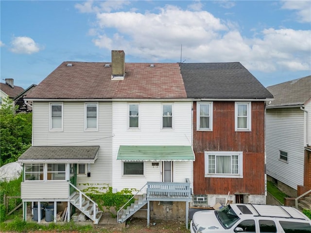 1630 Poplar Way, Braddock, PA 15104 - rear view of house featuring stairway, a sunroom, a chimney, and a shingled roof