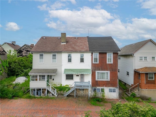 1630 Poplar Way, Braddock, PA 15104 - back of property with stairway, a chimney, and a sunroom