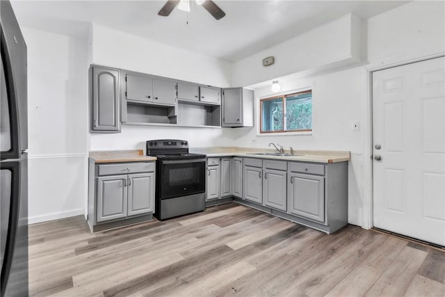 1630 Poplar Way, Braddock, PA 15104 - kitchen featuring gray cabinetry, electric range, freestanding refrigerator, a sink, and a ceiling fan