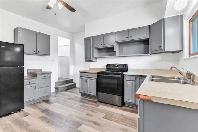 1630 Poplar Way, Braddock, PA 15104 - kitchen featuring black appliances, gray cabinetry, a sink, ceiling fan, and light wood-type flooring