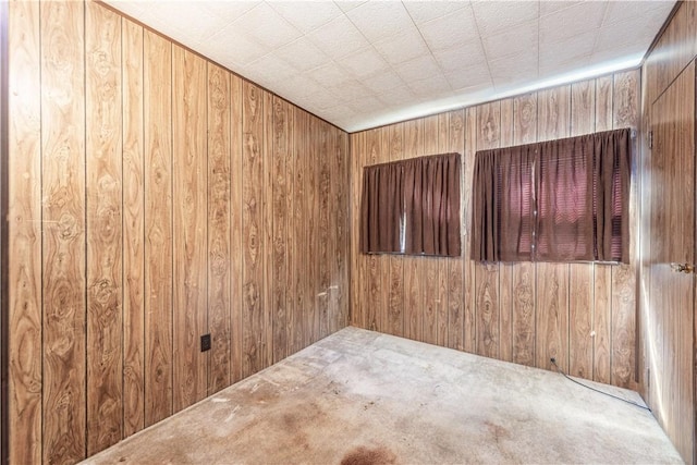 1028 Woodland Ave, Port Vue, PA 15133 - spare room with wooden walls and carpet