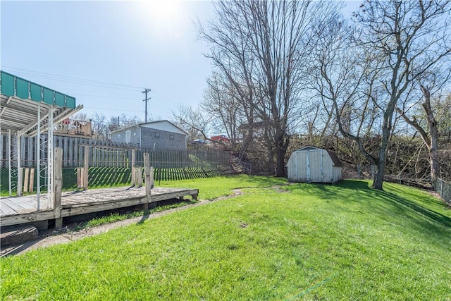 1028 Woodland Ave, Port Vue, PA 15133 - view of yard with a storage shed, a wooden deck, and an outdoor structure
