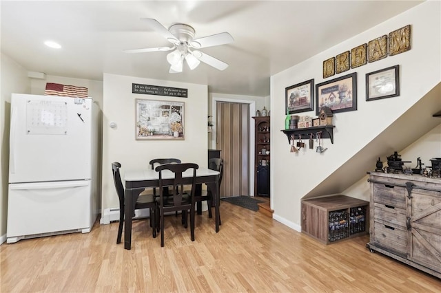 199 Latimer Ave, North Strabane, PA 15363 - dining space featuring light wood-style floors, a ceiling fan, and baseboards
