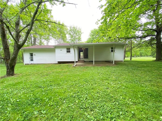 1196 Rutledge Rd, Pymatuning Twp, PA 16154 - rear view of property featuring a lawn and a patio area