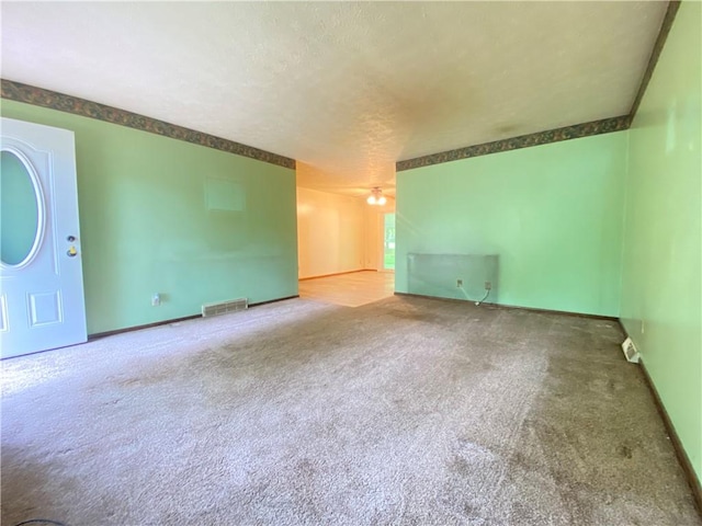 1196 Rutledge Rd, Pymatuning Twp, PA 16154 - unfurnished room with carpet flooring, a textured ceiling, and baseboards