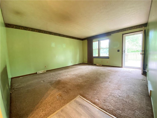 1196 Rutledge Rd, Pymatuning Twp, PA 16154 - carpeted spare room featuring a textured ceiling and baseboards