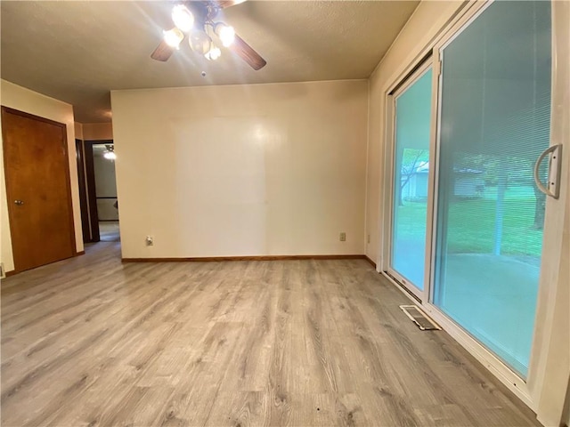 1196 Rutledge Rd, Pymatuning Twp, PA 16154 - empty room featuring light wood-style floors, a ceiling fan, and baseboards