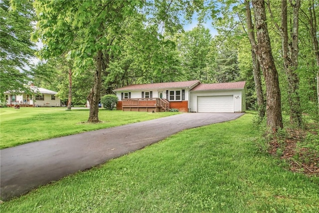 1196 Rutledge Rd, Pymatuning Twp, PA 16154 - view of front of property featuring driveway, an attached garage, a front yard, and brick siding