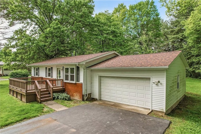 1196 Rutledge Rd, Pymatuning Twp, PA 16154 - single story home with a shingled roof, a front yard, brick siding, a deck, and a garage