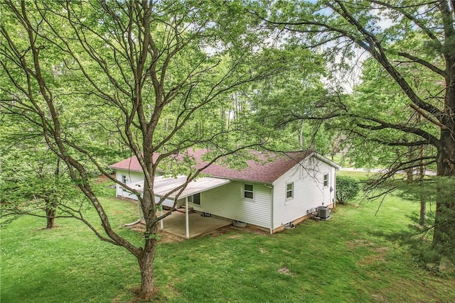 1196 Rutledge Rd, Pymatuning Twp, PA 16154 - view of property exterior featuring a yard, central air condition unit, and a shingled roof