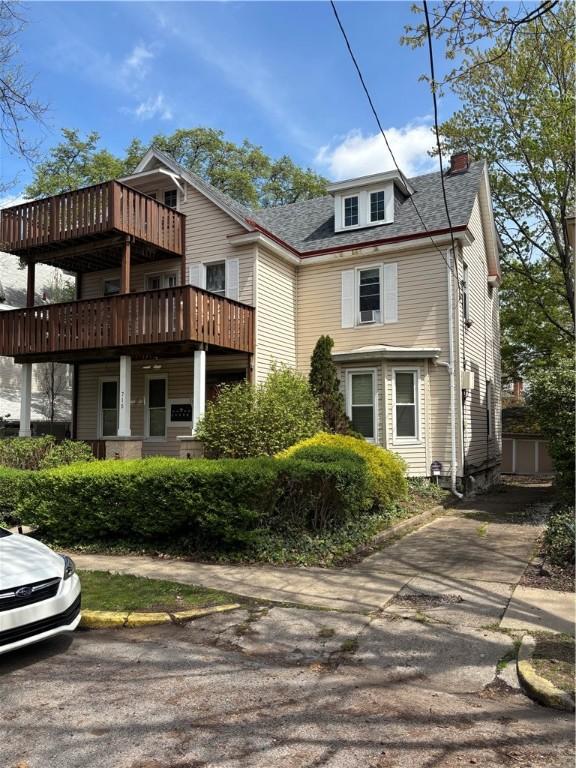 715 Ivy St, Shadyside, PA 15232 - view of front of home with a chimney and a wooden deck