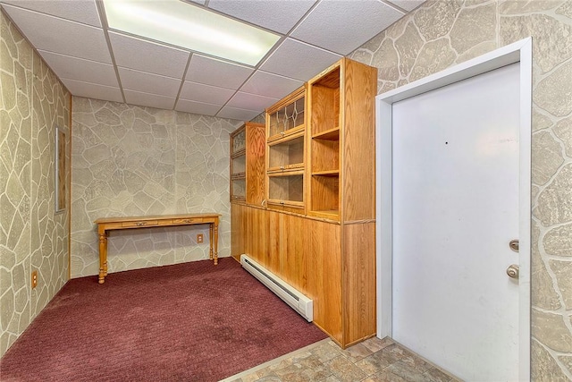 190 W Main St, Donegal Wml, PA 15628 - hallway featuring a baseboard heating unit, a paneled ceiling, wallpapered walls, stone finish floors, and carpet