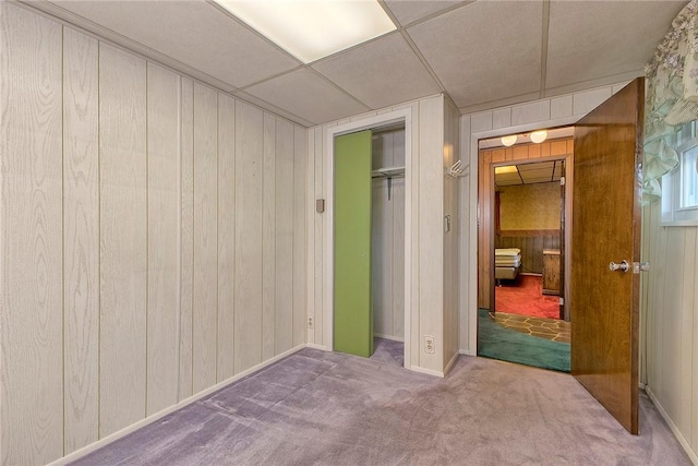 190 W Main St, Donegal Wml, PA 15628 - unfurnished bedroom featuring wooden walls, carpet flooring, and a closet