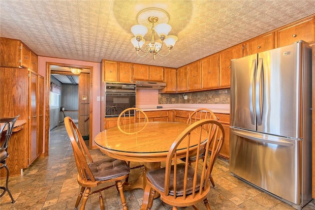 190 W Main St, Donegal Wml, PA 15628 - dining area featuring a chandelier, stone finish floors, and an ornate ceiling