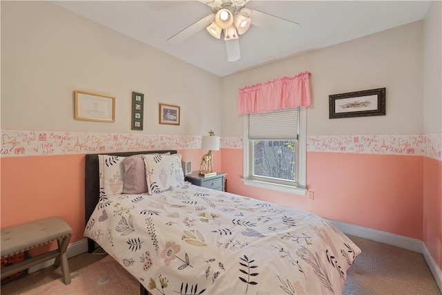 carpeted bedroom with a ceiling fan and baseboards